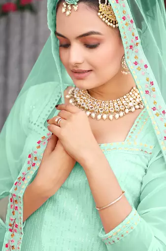  mint green ethnic dress material set featuring delicate floral embroidery with skirt & dupatta