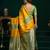 yellow soft art silk saree with fancy pumpum border