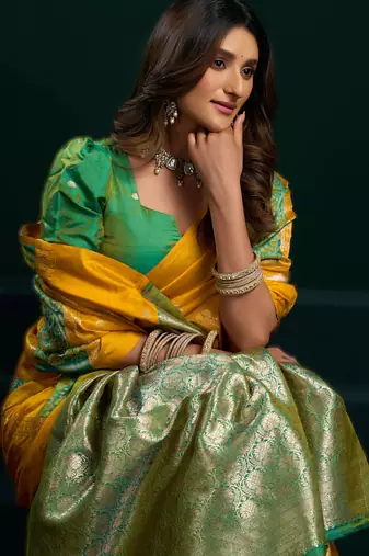 yellow soft art silk blend saree with fancy pumpum border