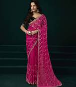 pink net saree with embroidered pallu work