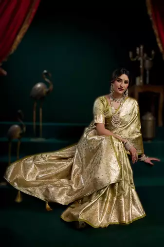 Light green premium satin silk blend saree with stylish pom-pom pallu