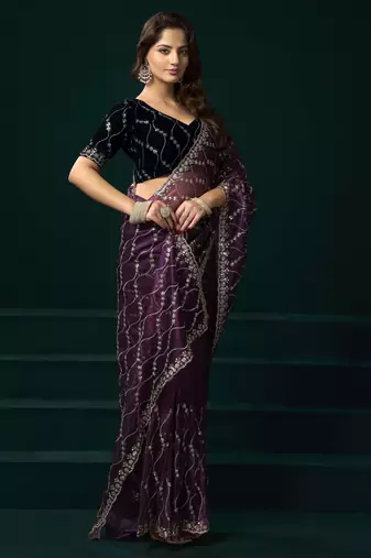 purple net saree with embroidered pallu work