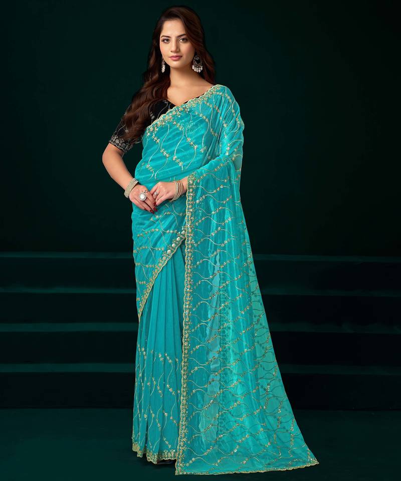 Turquoise net designer saree with sequins embroidery and velvet unstitched blouse