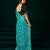 Turquoise net designer saree with sequins embroidery and velvet unstitched blouse