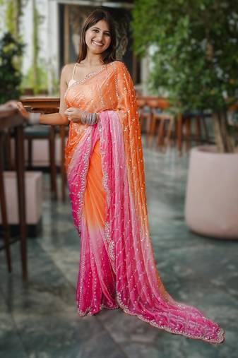orange party wear saree with original gold beads work