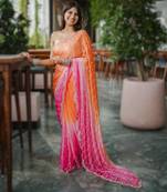 orange party wear saree with original gold beads work