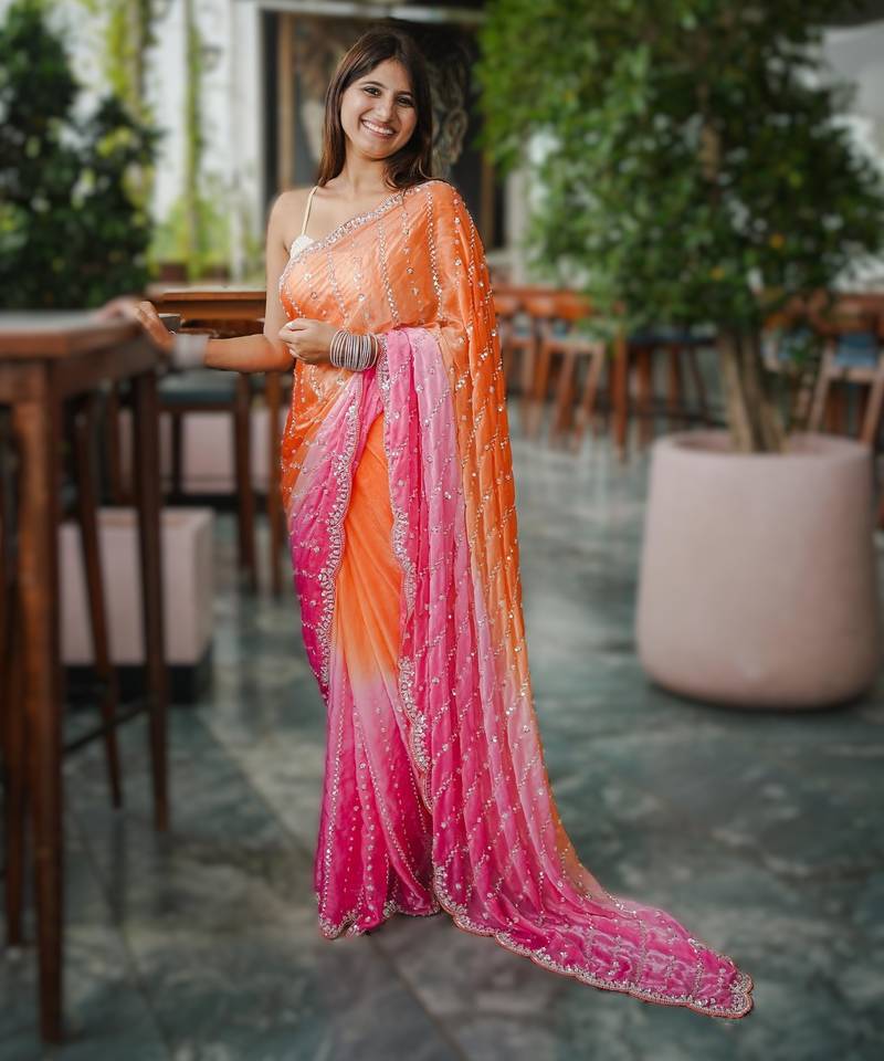 orange party wear saree with original gold beads work