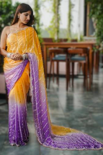 yellow party wear saree with original gold beads work