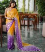 yellow party wear saree with original gold beads work