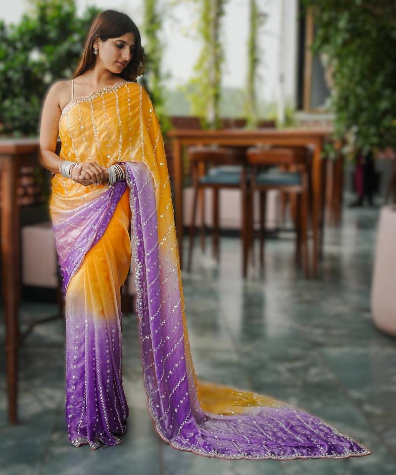 yellow party wear saree with original gold beads work