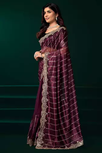 maroon net saree with heavy sequins embroidered designs