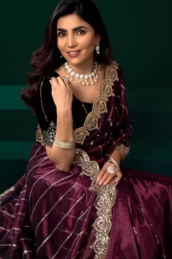 maroon net saree with heavy sequins embroidered designs