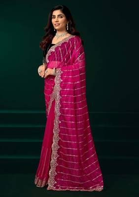 pink net saree with sequins embroidery and floral designs 2