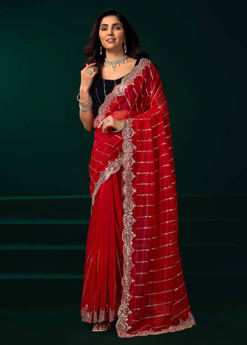 Red traditional net sequins work saree with unstitched velvet blouse