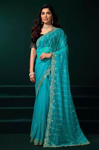 Turquoise net designer saree with sequins embroidery and velvet unstitched blouse