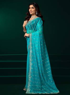 turquoise net saree with sequins embroidery 2