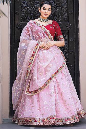 pink organza lehenga with red blouse