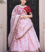 Fabulous Light Pink Thread Embroidery Organza Lehenga With Red Choli