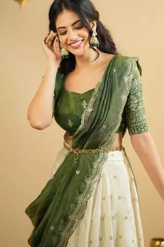 off white silk lehenga with green zari blouse