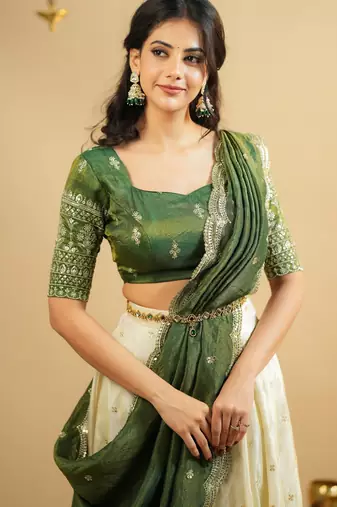 off white silk lehenga with green zari blouse