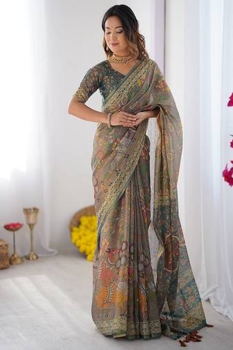 Teal green handloom cotton saree with floral print and royal elephant pallu