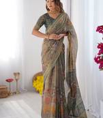 Teal green handloom cotton saree with floral print and royal elephant pallu