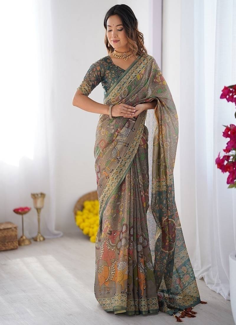 Teal green handloom cotton saree with floral print and royal elephant pallu