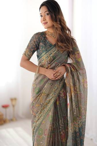 Teal green handloom cotton saree with floral print and royal elephant pallu