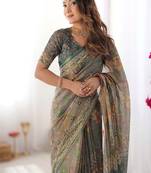 Teal green handloom cotton saree with floral print and royal elephant pallu