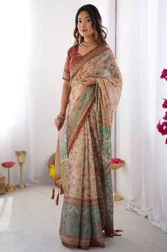 Beige handloom cotton saree with village life print and majestic peacock pallu