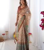 Beige handloom cotton saree with village life print and majestic peacock pallu