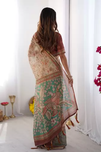 Beige handloom cotton saree with village life print and majestic peacock pallu