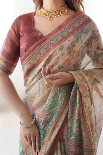 Beige handloom cotton saree with village life print and majestic peacock pallu