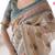 Beige handloom cotton saree with buti print, mandala motifs & peacock pallu