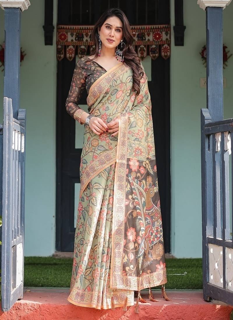 Olive green with bold floral motifs linen cotton handloom printed saree, vibrant peacock pallu, and tassels