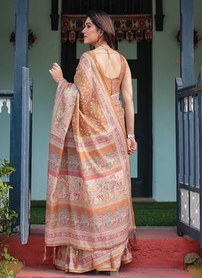 Brown handloom cotton-linen saree with floral motifs and rich zari border 3