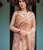 Brown handloom cotton-linen saree with floral motifs and rich zari border