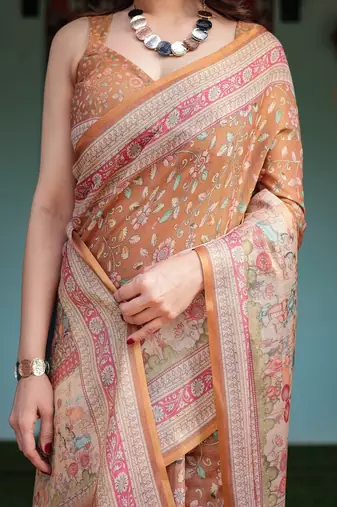 Brown handloom cotton-linen saree with floral motifs and rich zari border