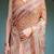 Brown handloom cotton-linen saree with floral motifs and rich zari border
