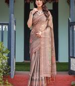 Earthy brown handloom cotton-linen saree with bird motifs and striped detailing