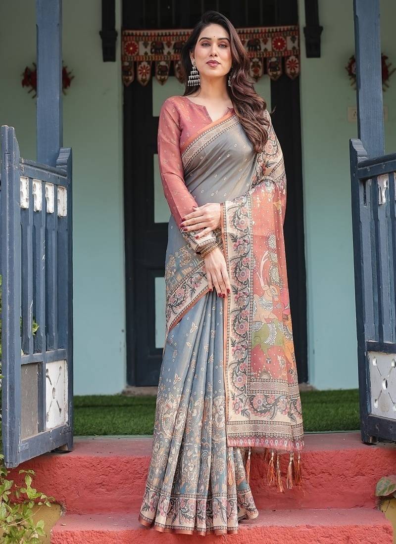 Smoky grey handloom cotton-linen saree with vibrant folk motifs and floral pallu