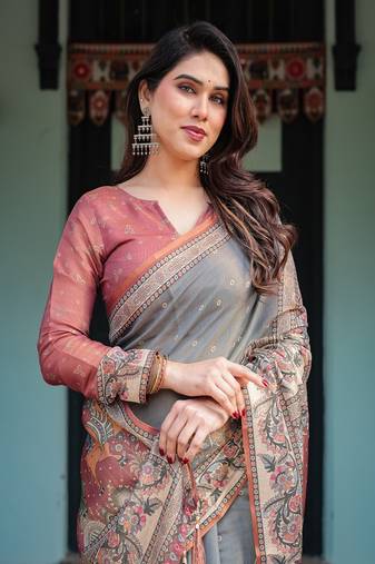 Smoky grey handloom cotton-linen saree with vibrant folk motifs and floral pallu