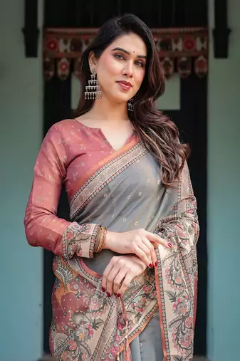 Smoky grey handloom cotton-linen saree with vibrant folk motifs and floral pallu