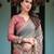 Smoky grey handloom cotton-linen saree with vibrant folk motifs and floral pallu