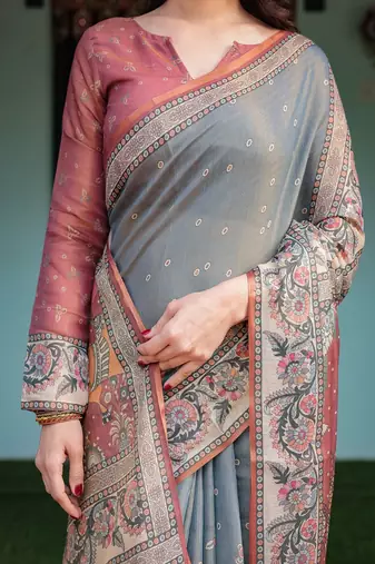 Smoky grey handloom cotton-linen saree with vibrant folk motifs and floral pallu