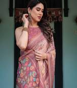 Dusty pink handloom cotton-linen saree with floral motifs and artistic pallu