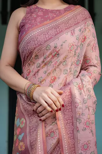 Dusty pink handloom cotton-linen saree with floral motifs and artistic pallu