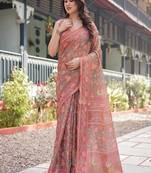 Copper brown handloom cotton-linen saree with floral motifs and vibrant pink accents