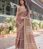 Rust and gold handloom cotton-linen saree with floral motifs and rich zari border