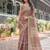 Rust and gold handloom cotton-linen saree with floral motifs and rich zari border